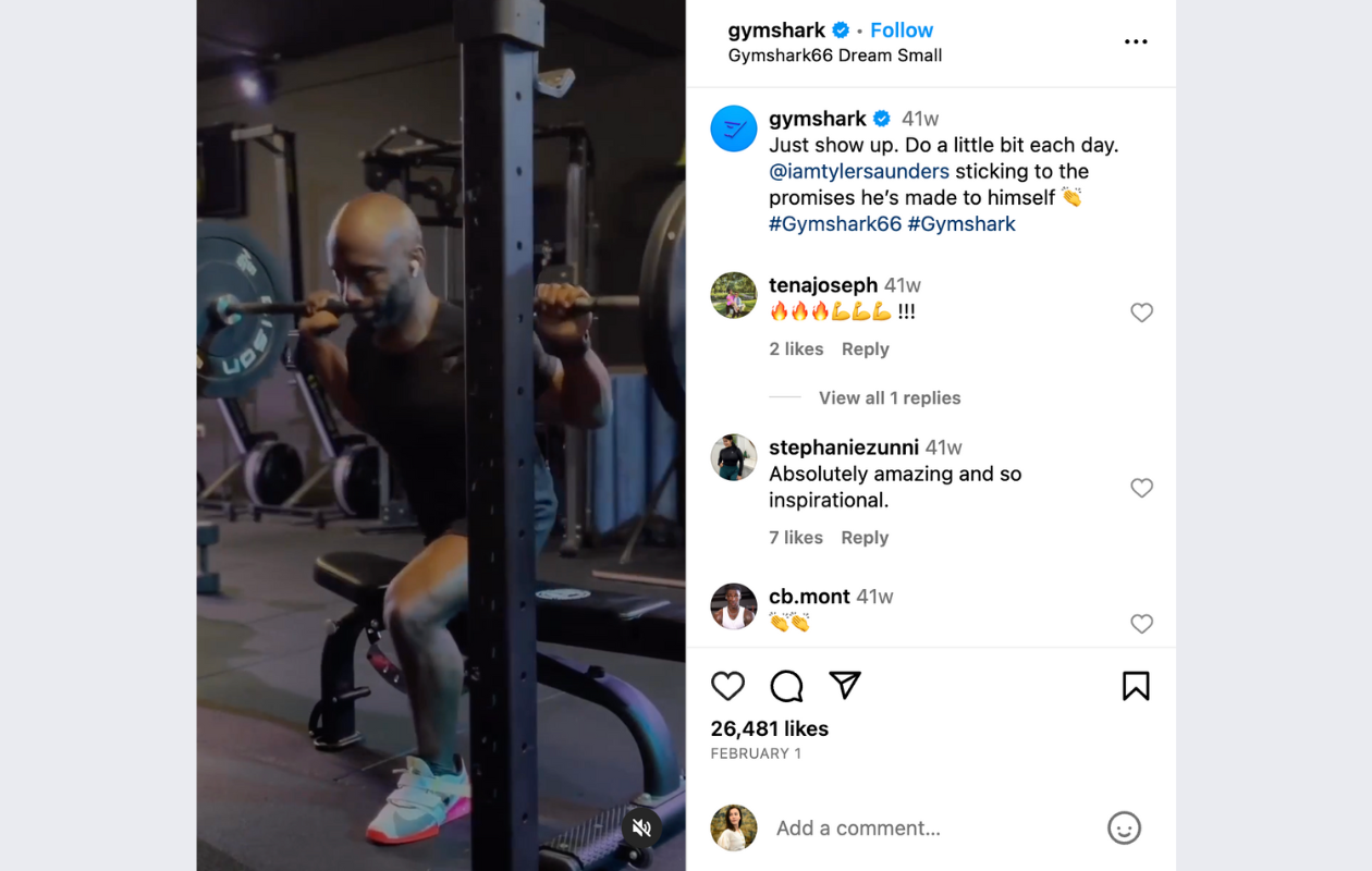 screenshot from gymshark's instagram post with a man of colour, wearing black t-shirt and black shorts, lifting weights