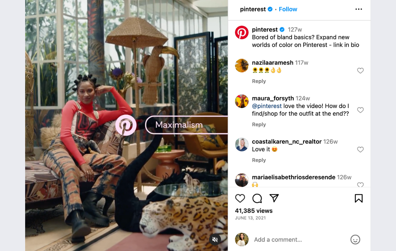 screenshot from pinterest's instagram reel with a girl dressed in a colorful jumpsuit and red top, sitting on a couch in a heavily decorated livingroom